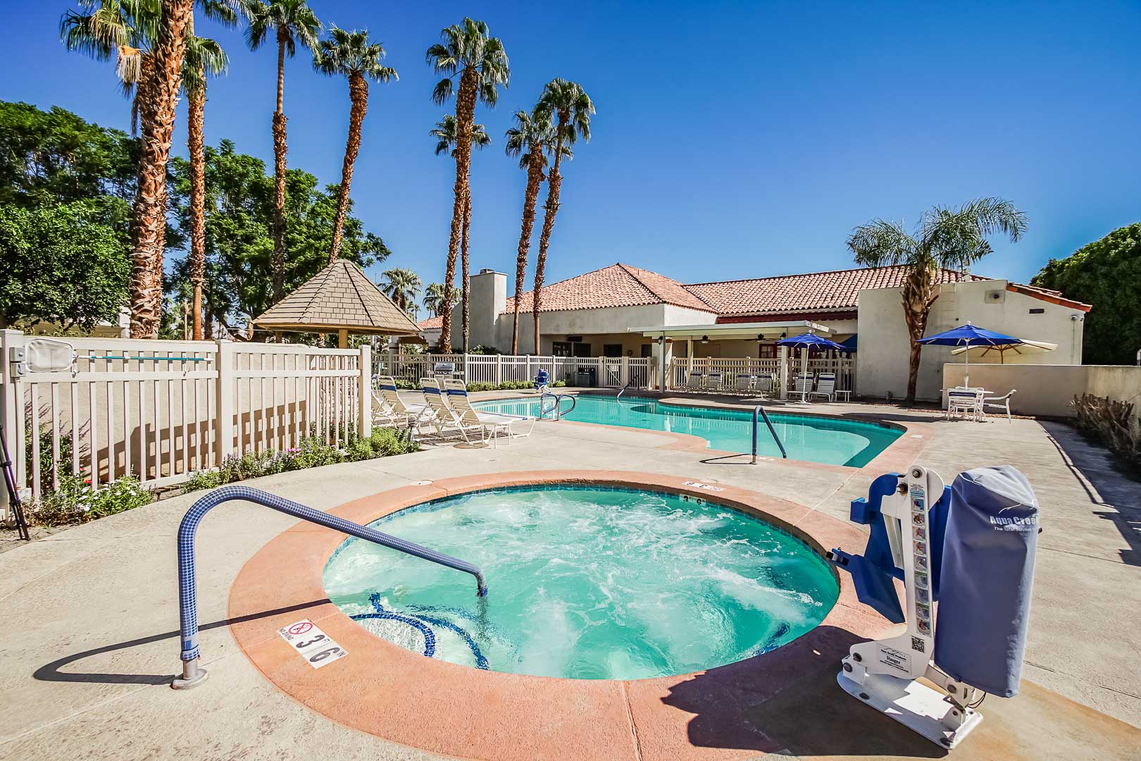 A pristine Pool and jacuzzi area at VRI Americas' Desert Breezes Resort in California